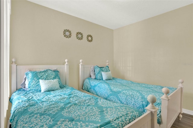 bedroom with wood-type flooring