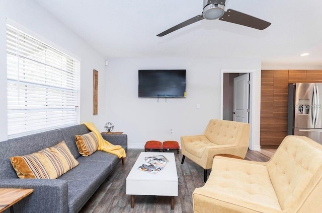 living room featuring dark hardwood / wood-style floors and ceiling fan