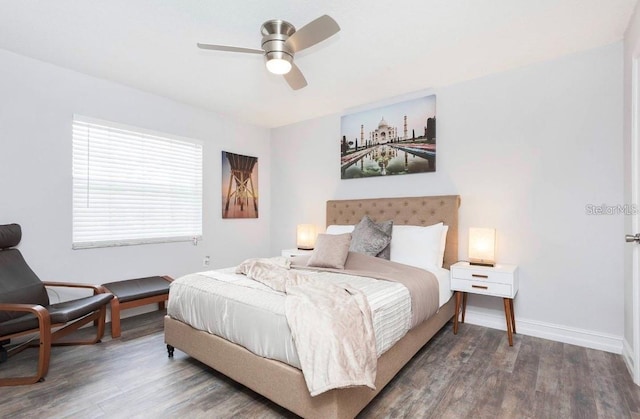 bedroom with hardwood / wood-style floors and ceiling fan