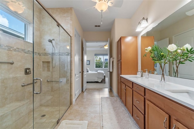 bathroom with vanity, ceiling fan, tile patterned floors, and an enclosed shower