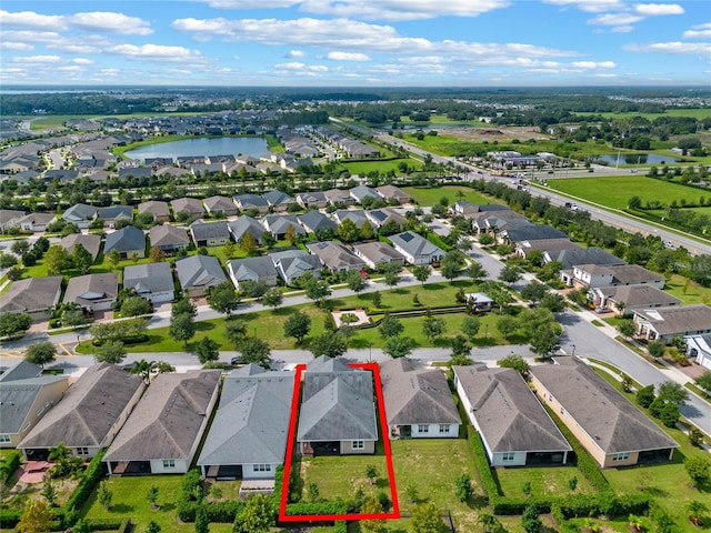 birds eye view of property featuring a water view