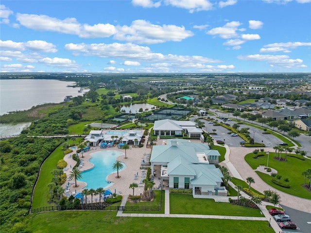 birds eye view of property with a water view