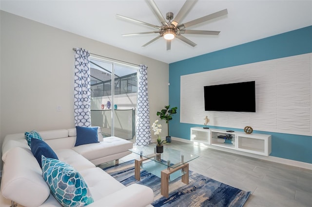 living room featuring ceiling fan and hardwood / wood-style flooring