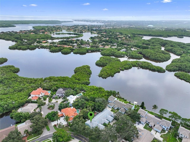 birds eye view of property with a residential view and a water view