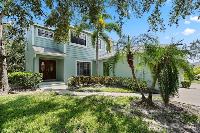 view of front of property with a front lawn