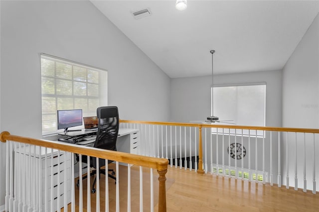 office featuring a ceiling fan, wood finished floors, and visible vents