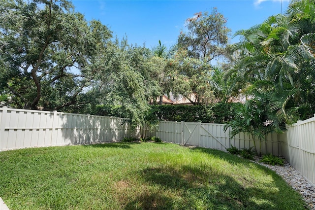 view of yard with a fenced backyard