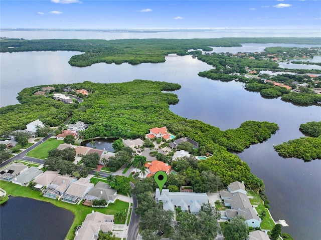 birds eye view of property with a residential view and a water view