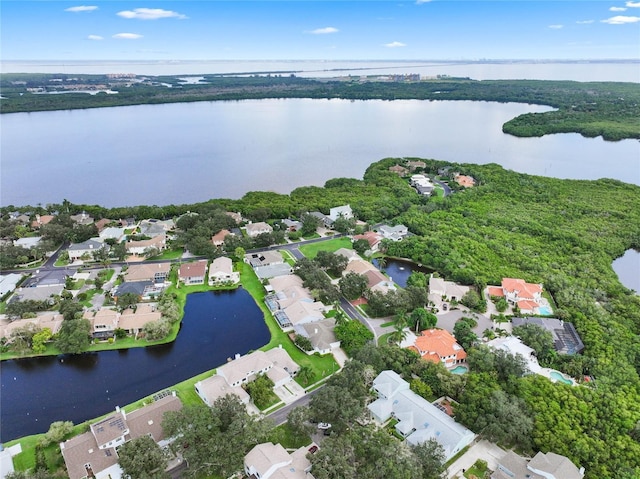 bird's eye view with a residential view and a water view
