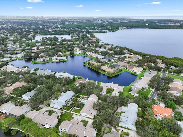 bird's eye view featuring a water view and a residential view