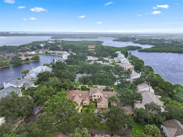 birds eye view of property with a water view and a residential view