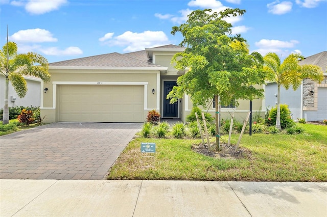 view of front facade featuring a front lawn and a garage