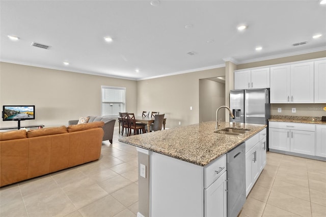 kitchen featuring a center island with sink, stainless steel appliances, sink, and white cabinetry