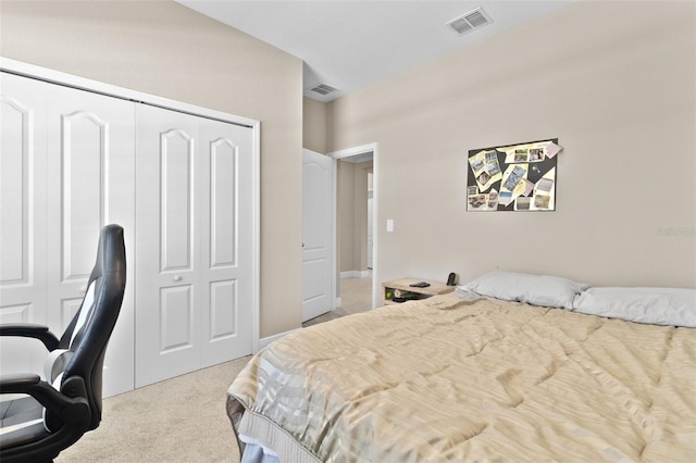 bedroom with light colored carpet and a closet