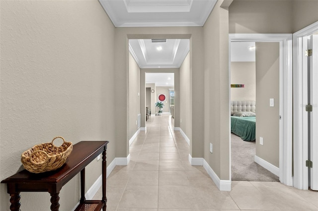 hall featuring ornamental molding and light colored carpet