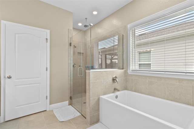 bathroom with tile patterned flooring and independent shower and bath