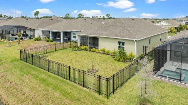 view of yard featuring a fenced in pool and glass enclosure