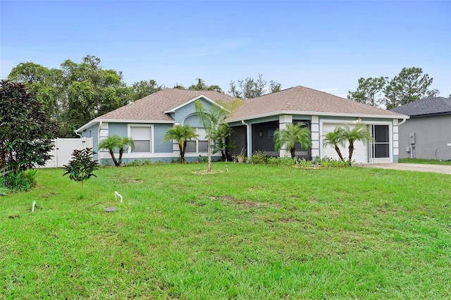 single story home with a front lawn and a sunroom