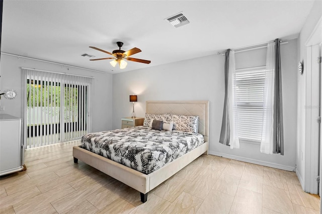 bedroom with access to outside and ceiling fan