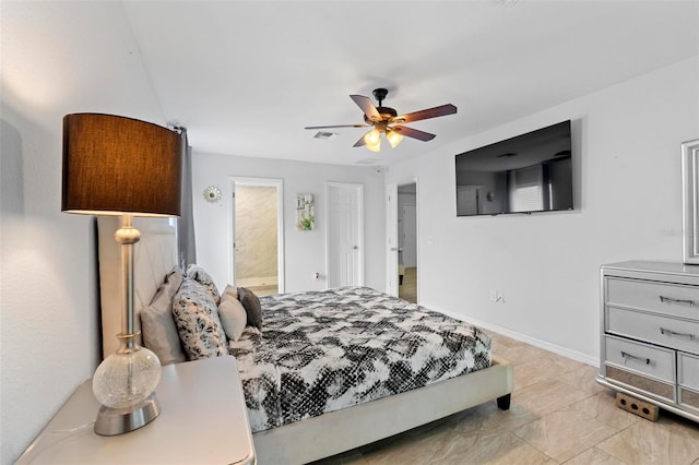 bedroom featuring ceiling fan and connected bathroom