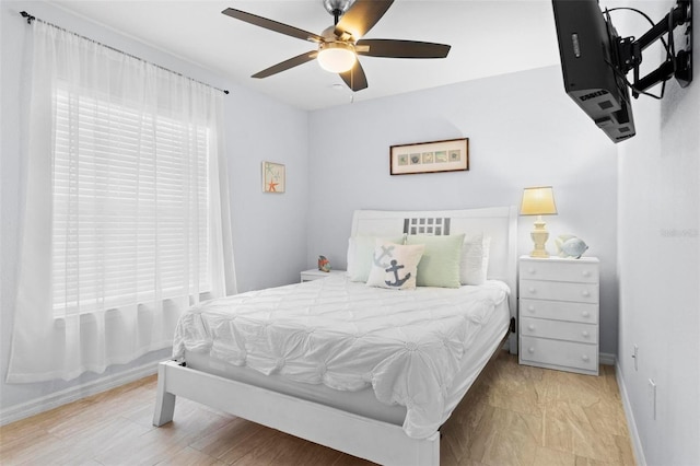 bedroom featuring light hardwood / wood-style floors and ceiling fan