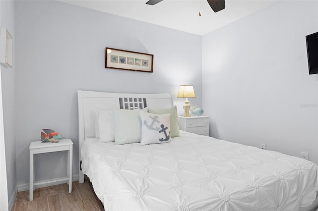 bedroom featuring hardwood / wood-style floors and ceiling fan