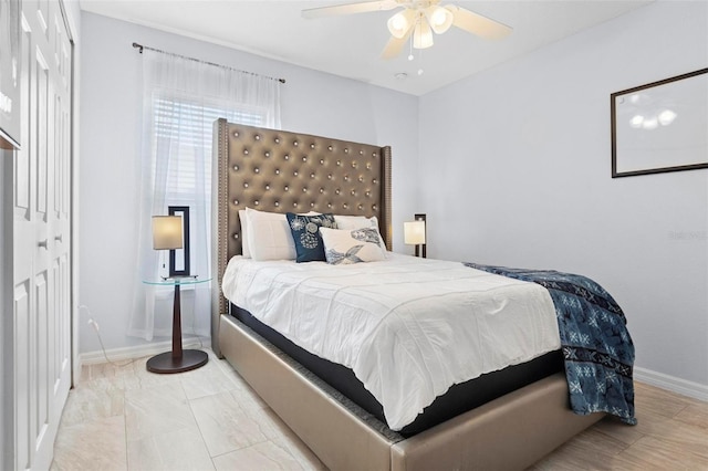 bedroom with ceiling fan and a closet