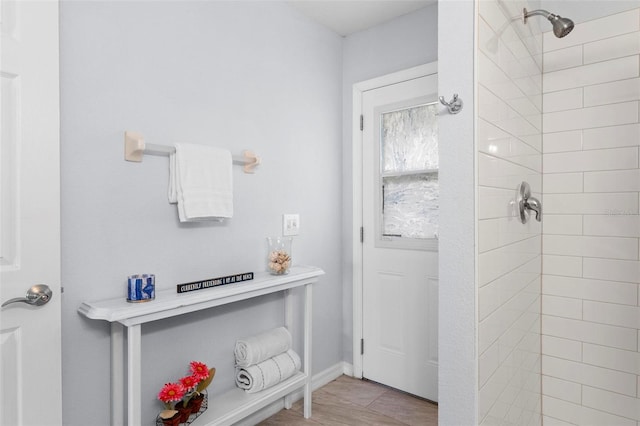 bathroom featuring a tile shower