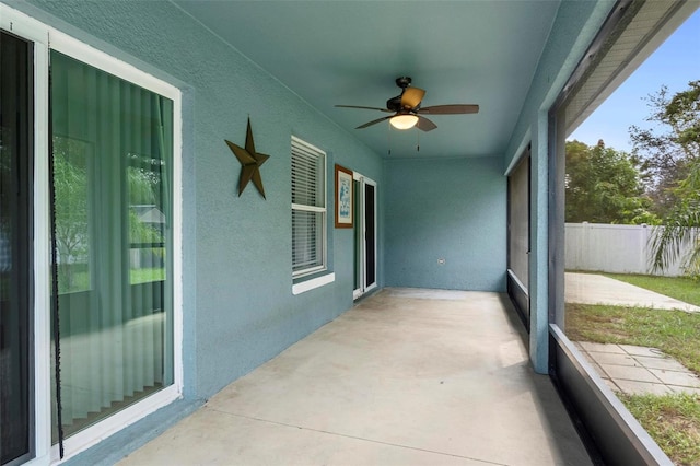 sunroom / solarium with ceiling fan