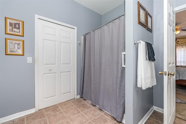 bathroom with tile patterned flooring and ceiling fan