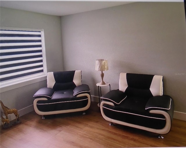 sitting room with hardwood / wood-style floors