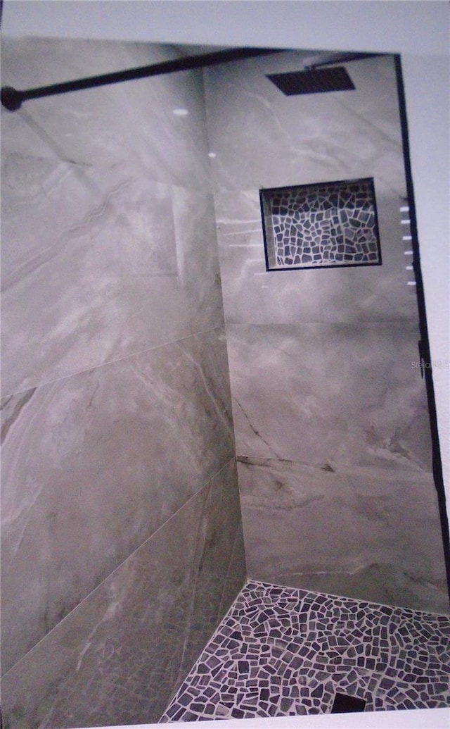 interior space with a tile shower