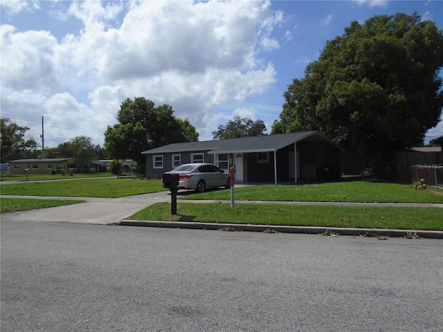 ranch-style house with a front lawn