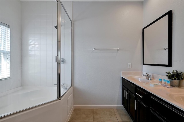 bathroom with tile patterned flooring, vanity, and combined bath / shower with glass door