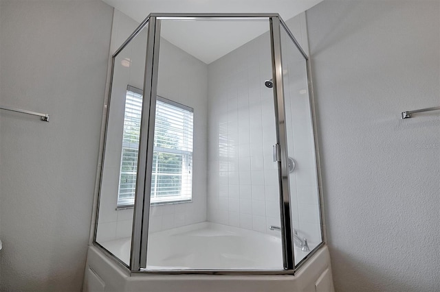 bathroom with separate shower and tub