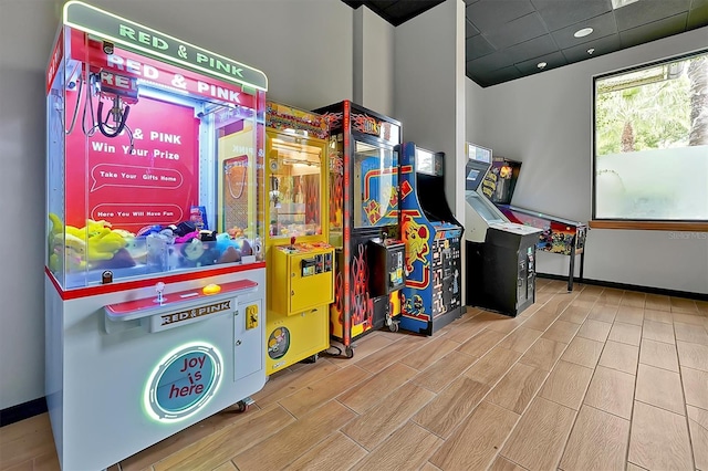 recreation room with light hardwood / wood-style floors