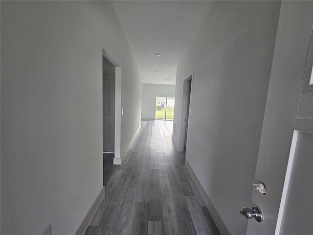 1378 Wilmette St, Port Charlotte, FL 33980 - corridor featuring dark wood finished floors and baseboards