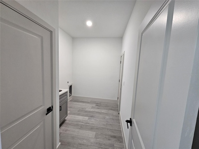 1378 Wilmette St, Port Charlotte, FL 33980 - clothes washing area with hookup for an electric dryer, light wood finished floors, recessed lighting, and baseboards