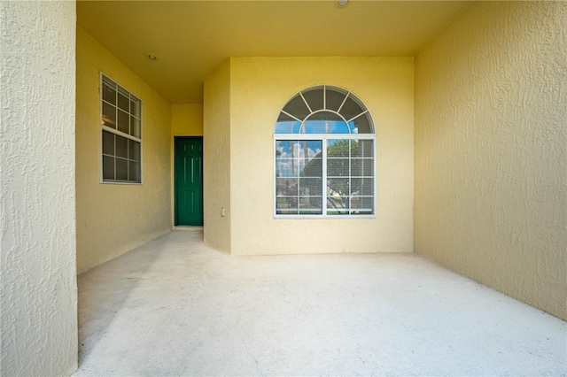 doorway to property featuring a patio area