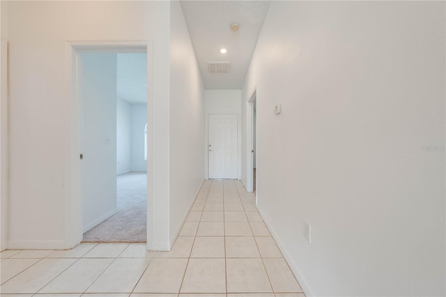 corridor with light tile patterned flooring