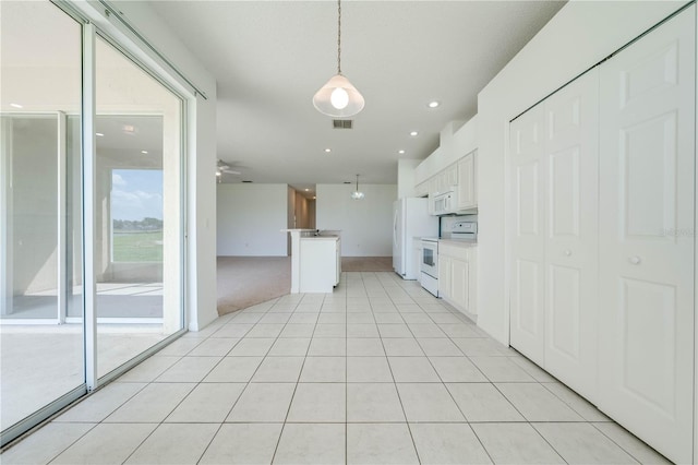 kitchen featuring white cabinets, white appliances, light tile patterned floors, ceiling fan, and decorative light fixtures