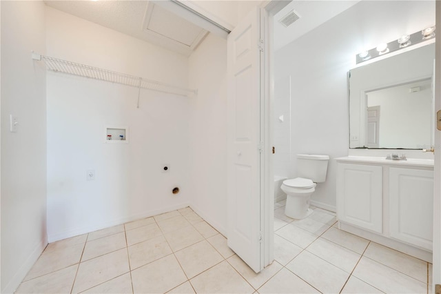 laundry area featuring electric dryer hookup, hookup for a washing machine, and light tile patterned floors