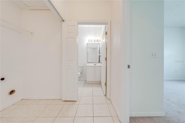 hallway featuring light tile patterned floors