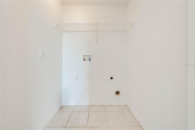 laundry room with hookup for an electric dryer, hookup for a washing machine, and light tile patterned floors