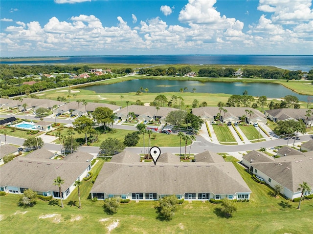 birds eye view of property with a water view