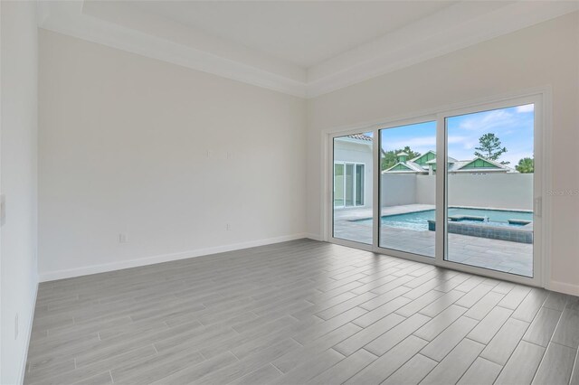 spare room featuring light wood-type flooring