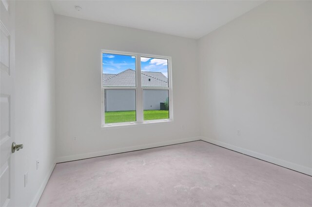 empty room featuring light carpet