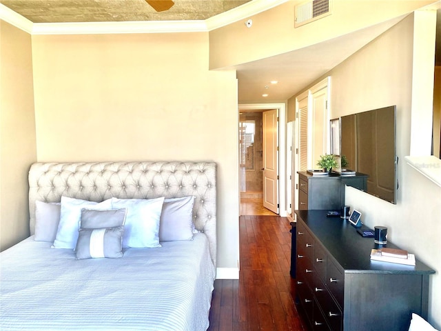 bedroom featuring crown molding and dark hardwood / wood-style flooring