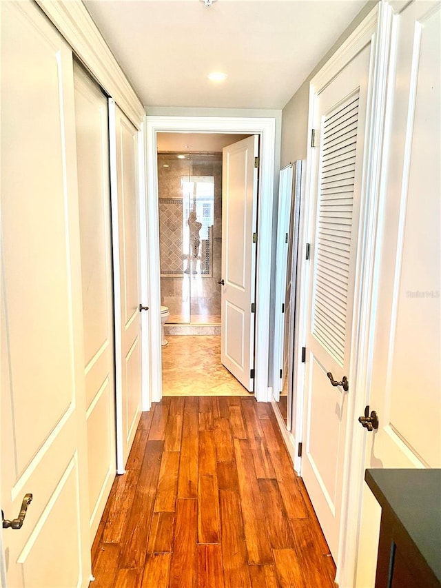 hallway featuring hardwood / wood-style floors