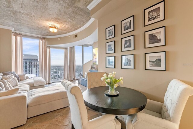 155 S Court Ave Unit 2710, Orlando, FL 32801 - dining space featuring healthy amount of natural light, crown molding, and light tile patterned floors
